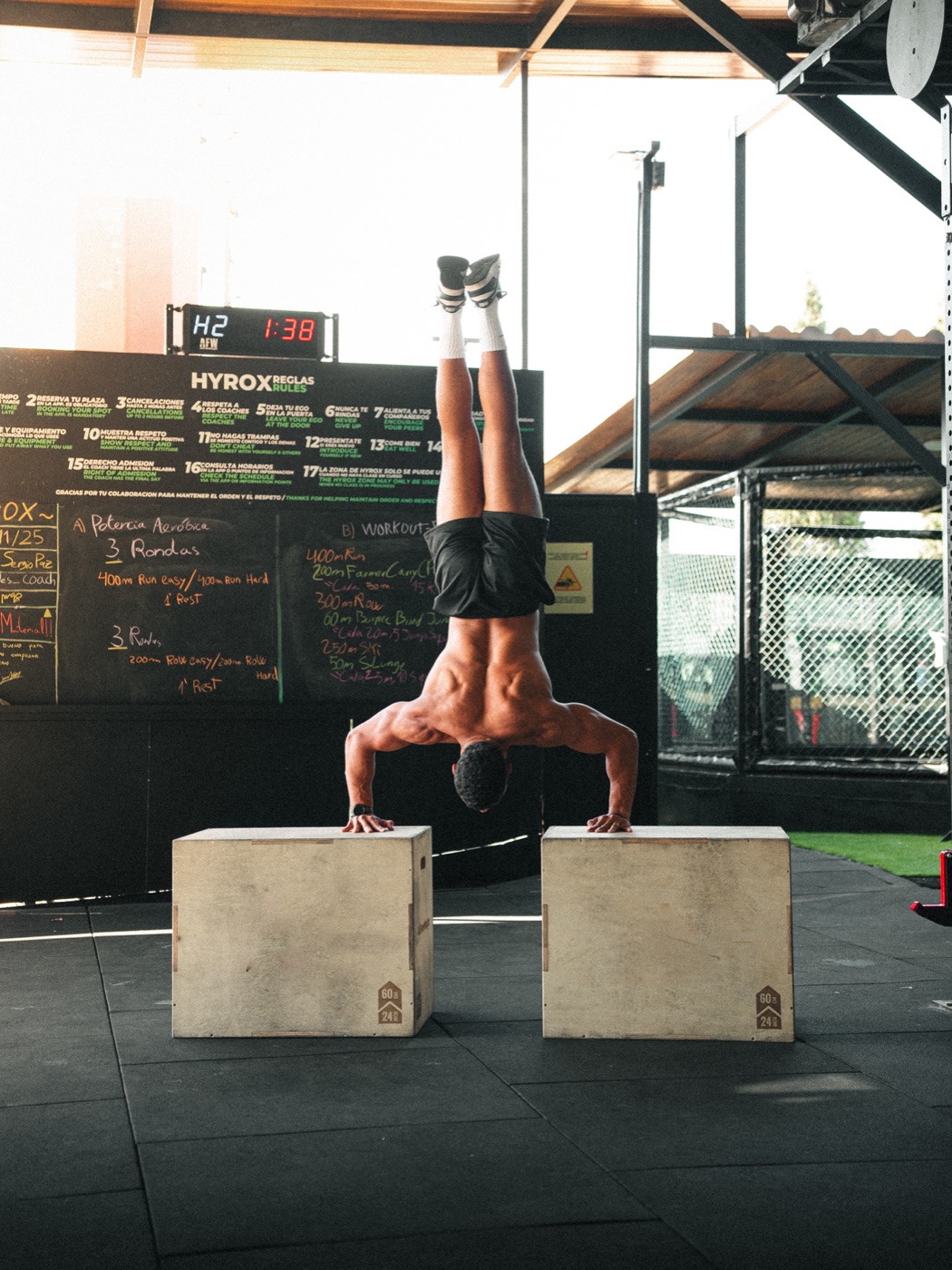 Ismael Rachidi doing handstand push-ups on two boxes